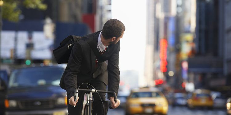 Man riding bicycle on street